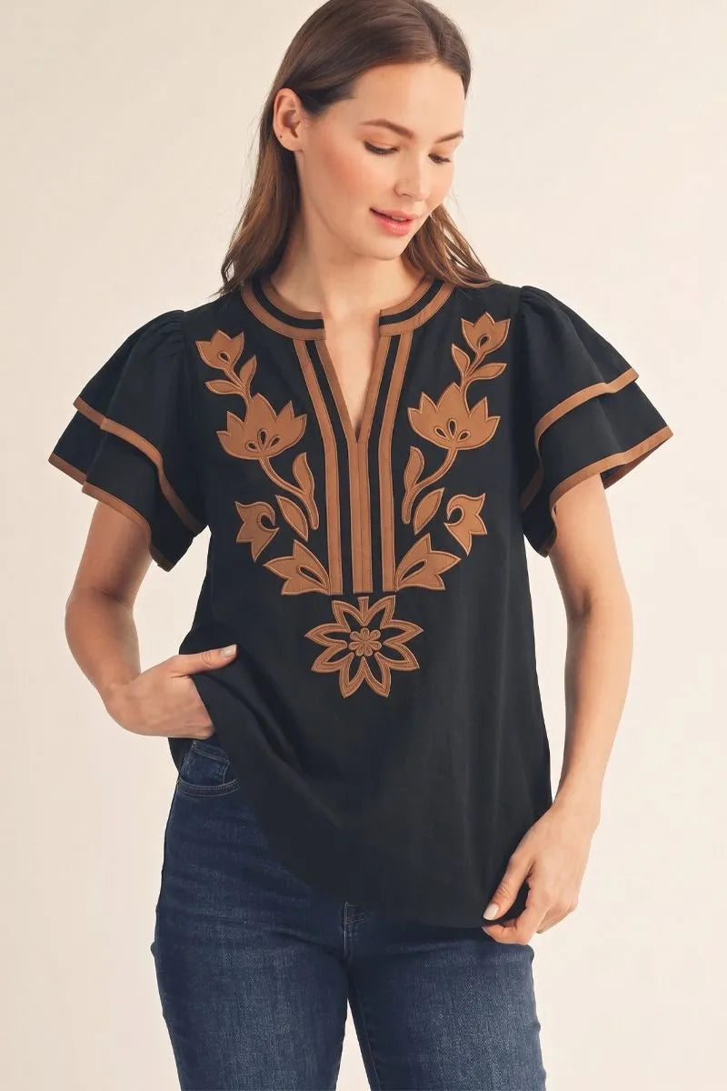 Solid crinkle top with floral applique detail